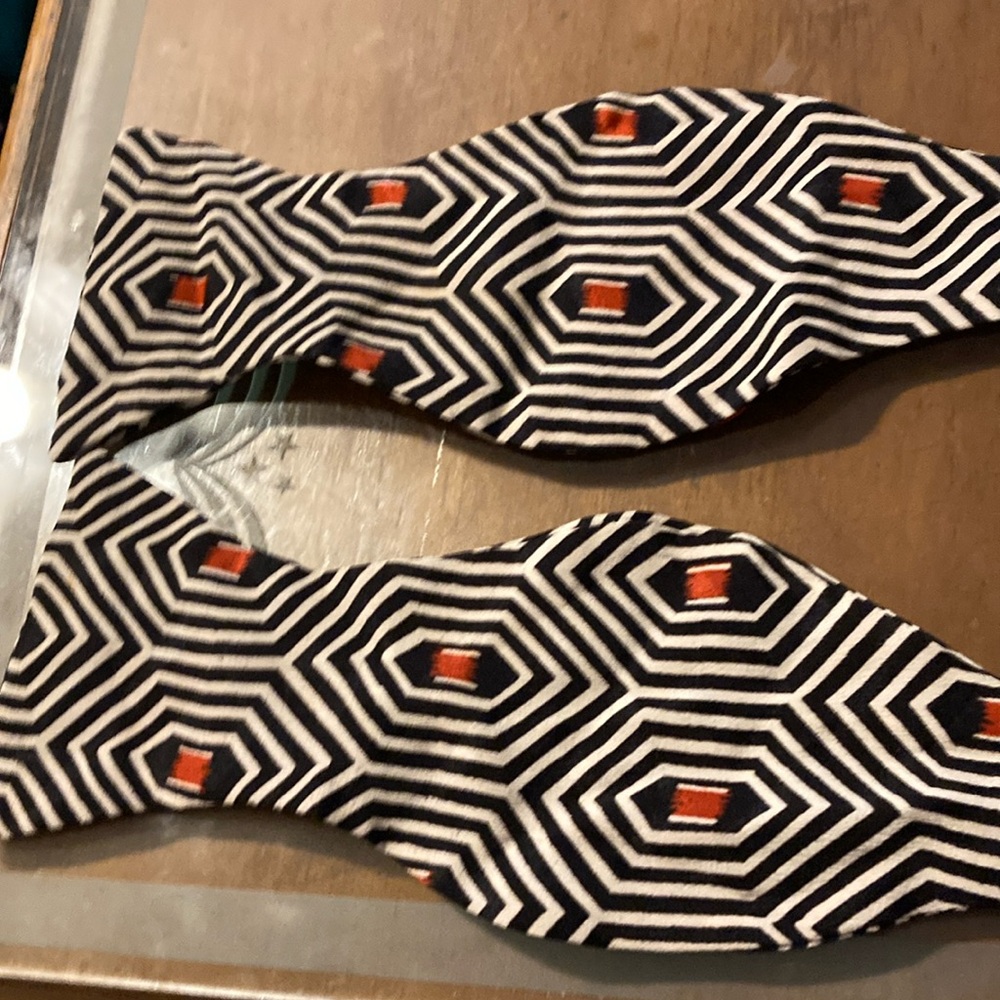 Onano black, white, and red bow tie.